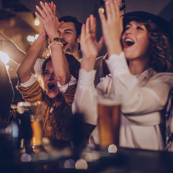 people celebrating at bar